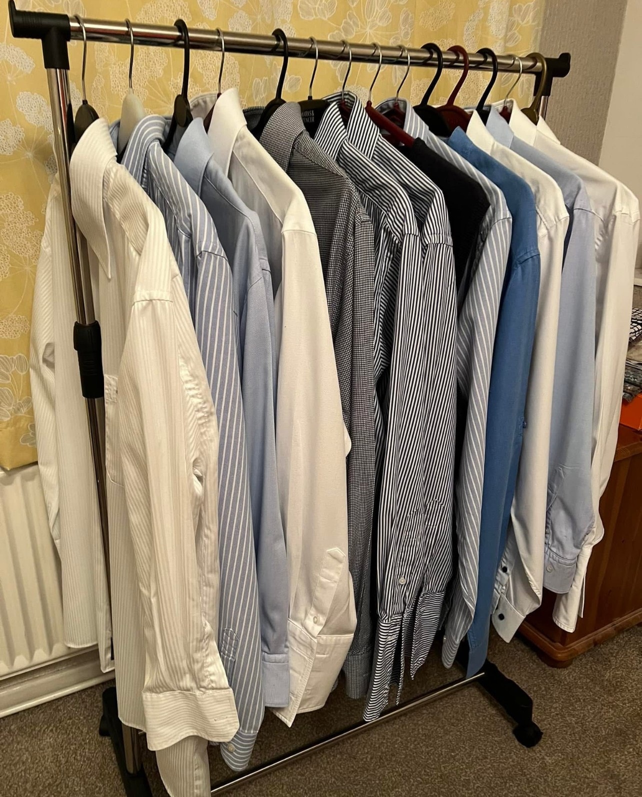Freshly laundered shirts on a rail